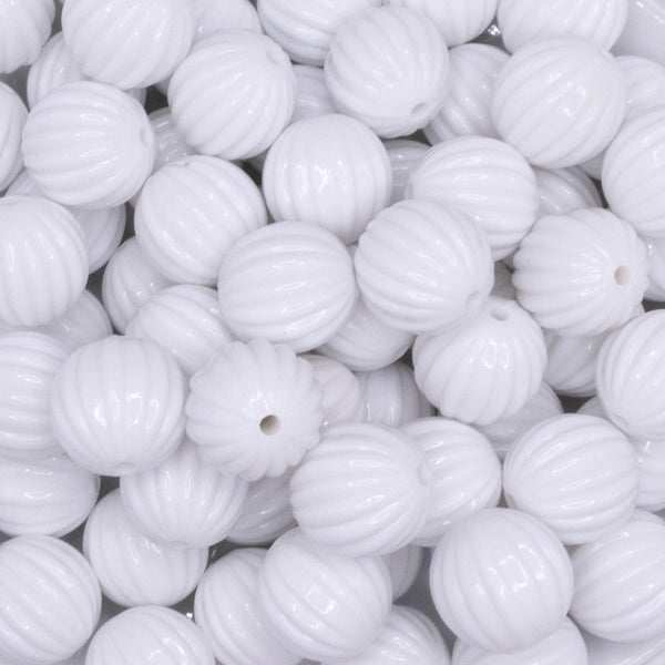 close up view of a pile of 16mm White Opaque Pumpkin Shaped Bubblegum Bead