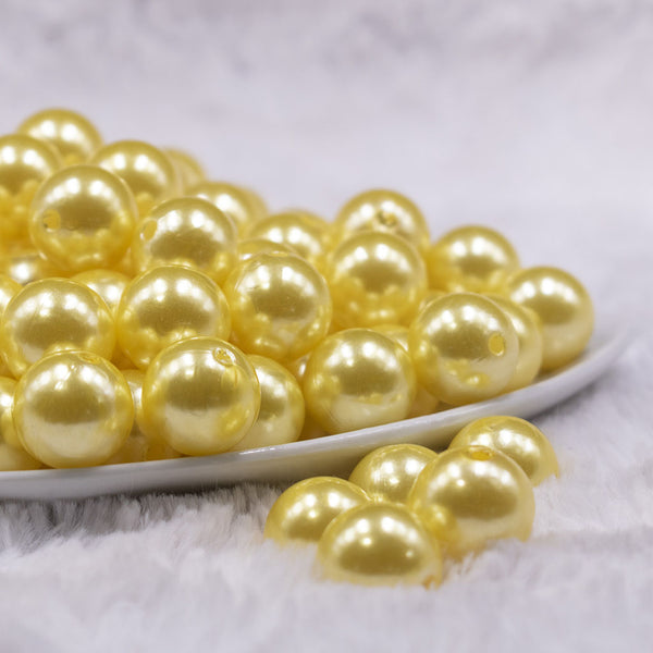 Front view of a pile of 16mm Yellow Faux Pearl Acrylic Bubblegum Jewelry Beads