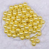 Top view of a pile of 16mm Yellow Faux Pearl Acrylic Bubblegum Jewelry Beads