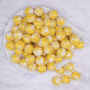 top view of a pile of 16mm Yellow Tablet Acrylic Bubblegum Beads