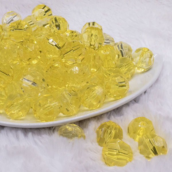 front view of a pile of 16mm Yellow Transparent Faceted Bubblegum Beads