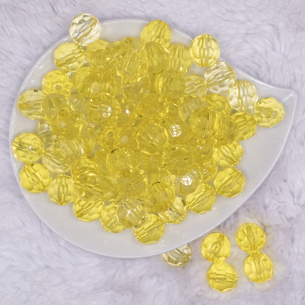 top view of a pile of 16mm Yellow Transparent Faceted Bubblegum Beads