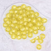 top view of a pile of 16mm Yellow Transparent Pumpkin Shaped Bubblegum Beads
