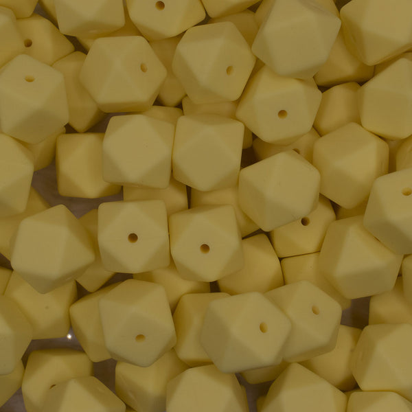 front view of a pile of 17mm Cream Yellow Hexagon Silicone Bead