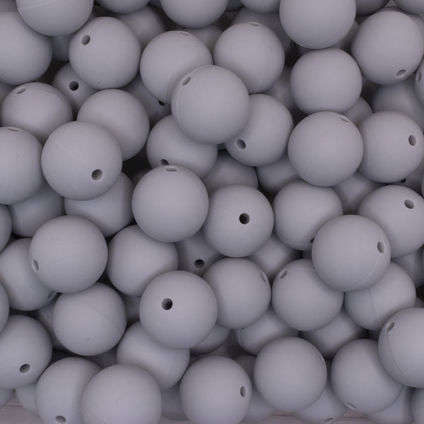 close up view of a pile of 19mm Light Gray Round Silicone Bead