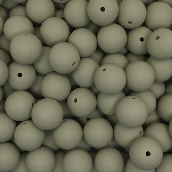 close up view of a pile of 19mm Macha Green Round Silicone Bead