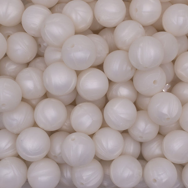 close up view of a pile of 19mm Metallic White Round Silicone Bead