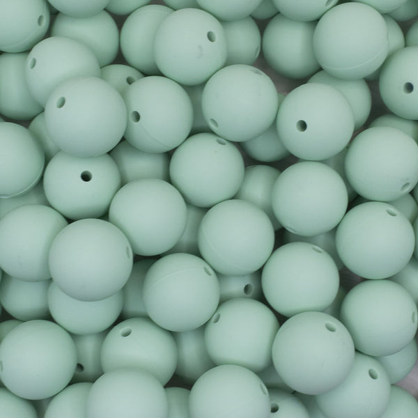 close up view of a pile of 19mm Mint Green Round Silicone Bead