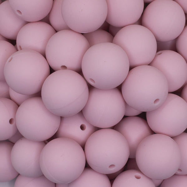 close up view of a pile of 19mm Quartz Pink Round Silicone Bead
