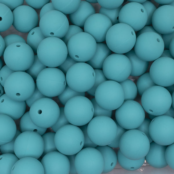 close up view of a pile of 19mm Turquoise Round Silicone Bead