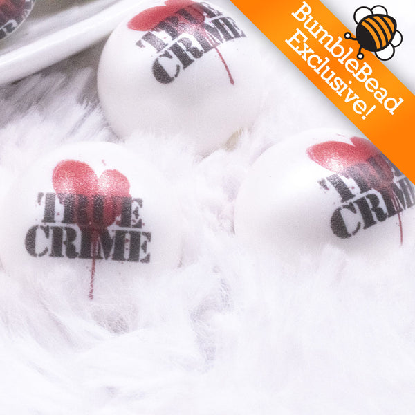 Macro view of a pile of 20mm True Crime print on Matte White Acrylic Bubblegum Beads