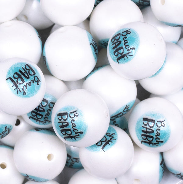 Close up view of a pile of 20mm Beach Babe print on Matte White Chunky Acrylic Bubblegum Beads jewelry