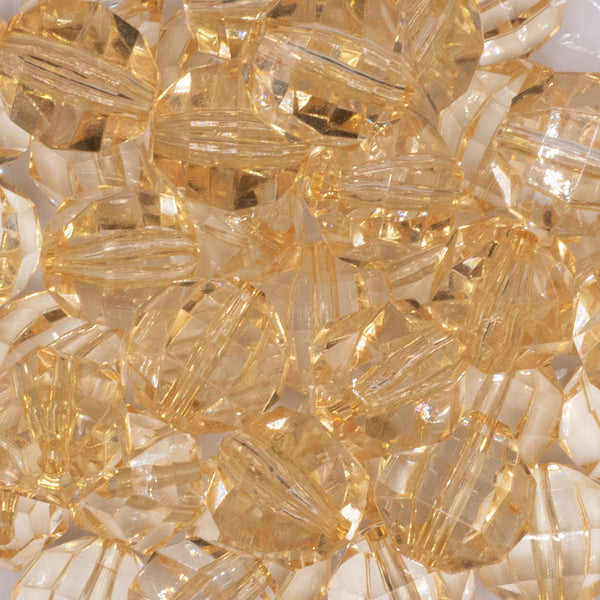 close up view of a pile of 20mm Blonde Yellow Transparent Faceted Bubblegum Beads