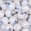 Close up view of a pile of 20mm Play Time Dog Print on Matte White Chunky Acrylic Bubblegum Beads