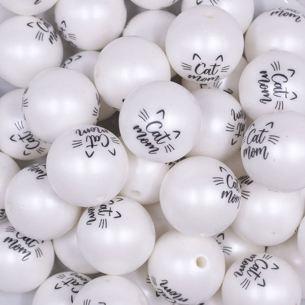 Close up view of a pile of 20mm Cat Mom Print on Matte White Chunky Acrylic Bubblegum Beads