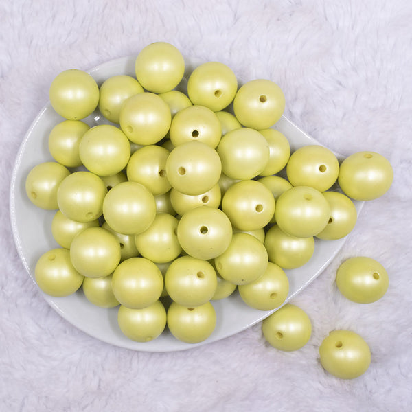 top view of a pile of 20mm Lime Green Matte Pearl Solid Jewelry Acrylic Bubblegum Beads