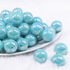 Front view of a pile of 20MM Medium Blue Neon AB Solid Chunky Bubblegum Beads