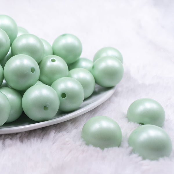Front view of a pile of 20mm Mint Green Matte Pearl Solid Jewelry Acrylic Bubblegum Beads
