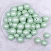 Top view of a pile of 20mm Mint Green Matte Pearl Solid Jewelry Acrylic Bubblegum Beads
