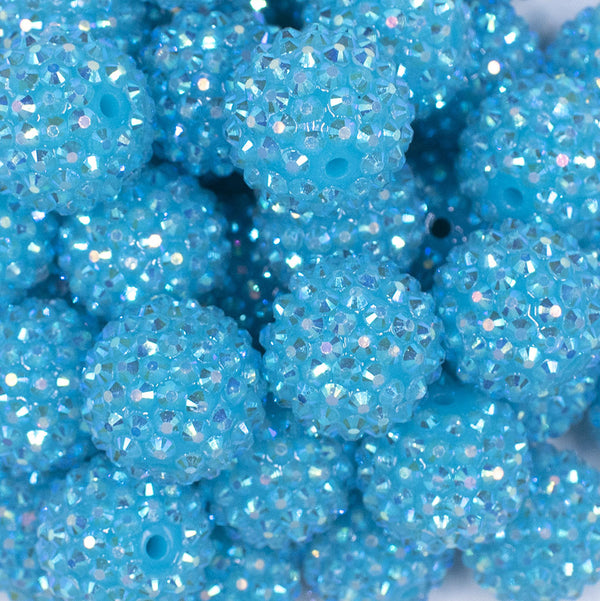 Close up view of a pile of 20mm Neon Blue Rhinestone AB Bubblegum Beads