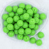 Top view of a pile of 20mm Neon Green Solid Bubblegum Beads