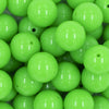 Close up view of a pile of 20mm Neon Green Solid Bubblegum Beads