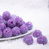 front view of a pile of 20mm Neon Purple Rhinestone AB Bubblegum Beads