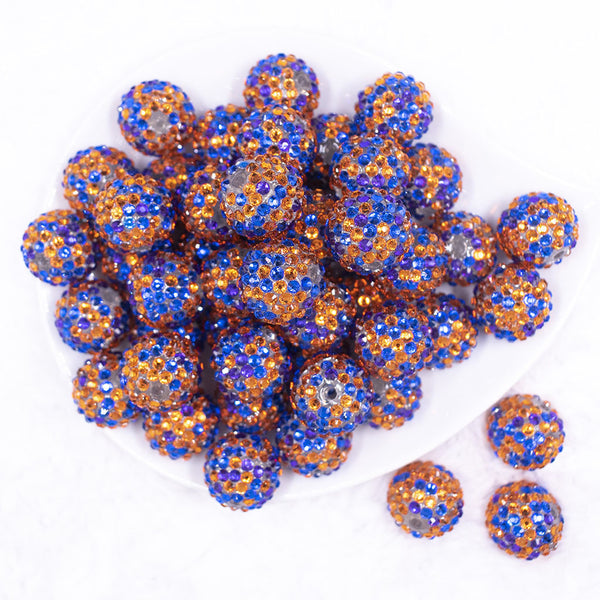 Top view of a pile of 20mm Blue, Orange & Purple Confetti Rhinestone Bubblegum Beads