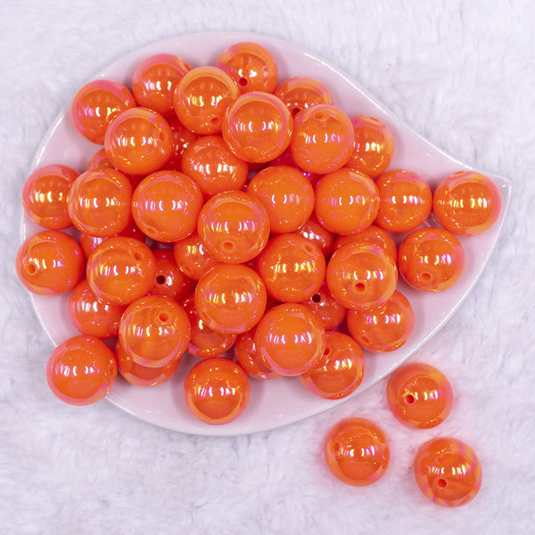 Top view of a pile of 20MM Orange Neon AB Solid Chunky Bubblegum Beads