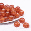 front view of a pile of 20mm Orange Glitter Sparkle Chunky Acrylic Bubblegum Beads