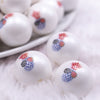 Macro view of a pile of 20mm Patriotic Pineapple print on Matte White Chunky Acrylic Bubblegum Beads jewelry