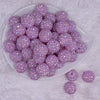 top view of a pile of 20mm Periwinkle Purple Rhinestone AB Acrylic Bubblegum Beads