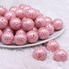 front view of a pile of 20mm Pink with Gold Mermaid Scales Print Bubblegum Beads