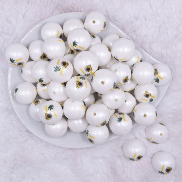 Top view of a pile of 20mm Marijauna Leaf Love Print on Matte White Acrylic Bubblegum Beads
