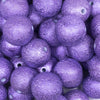 Close up view of a pile of 20mm Purple Stardust Chunky Jewelry Bubblegum Beads