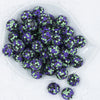 Top view of a pile of 20mm Purple, Green & Black Confetti Rhinestone AB Bubblegum Beads