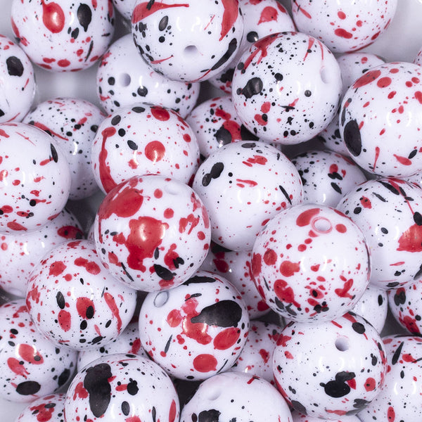 close up view of a pile of 20mm Black & Red Splatter on White Chunky Acrylic Bubblegum Beads