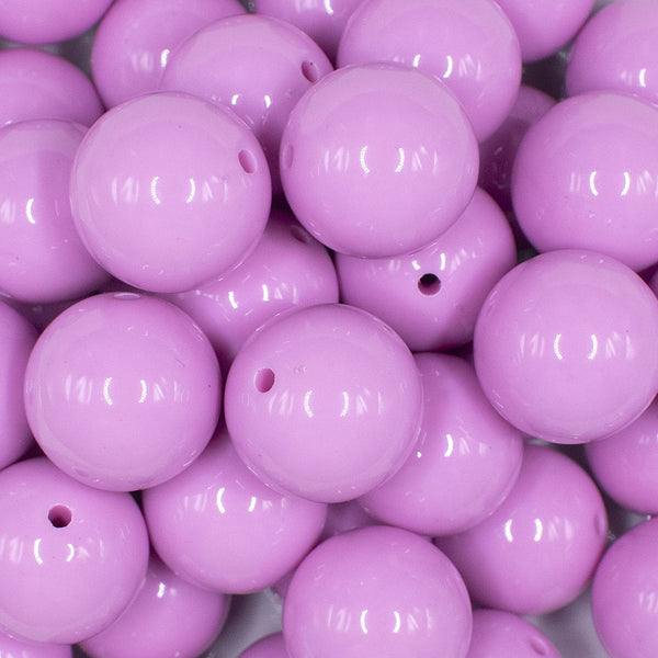 Close up view of a pile of 20mm Taffy Pink Solid Acrylic Chunky Bubblegum Beads