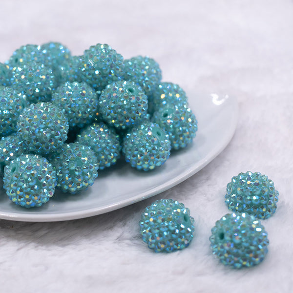 Front view of a pile of 20mm Teal Rhinestone AB Bubblegum Beads
