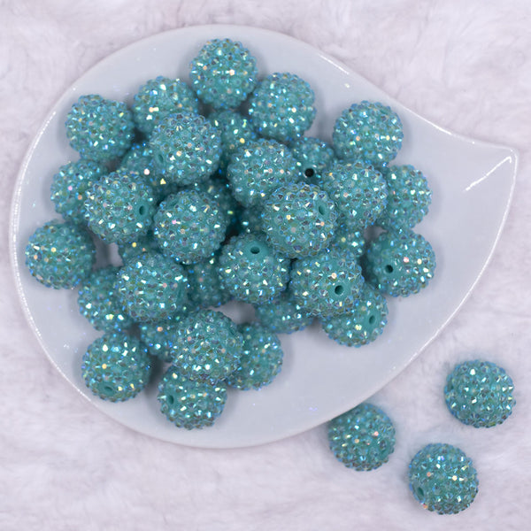 Top view of a pile of 20mm Teal Rhinestone AB Bubblegum Beads