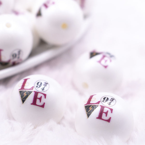 Macro view of a pile of 20mm Wizardly Love print on Matte White Chunky Acrylic Bubblegum Beads jewelry
