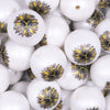 Close up view of a Pile of 20mm Sunflower with Yellowstone Y print on Matte White Chunky Acrylic Bubblegum Beads Jewelry