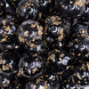 close up view of a pile of 20mm Black and Gold Flake Resin Chunky Bubblegum Beads