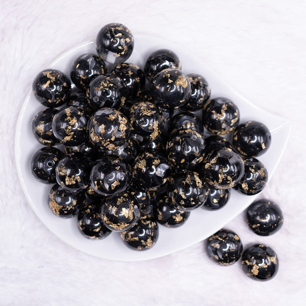 top view of a pile of 20mm Black and Gold Flake Resin Chunky Bubblegum Beads
