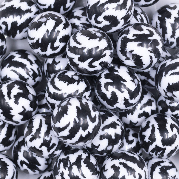 Close up view of a pile of 20mm Black & White Animal Print Bubblegum Beads