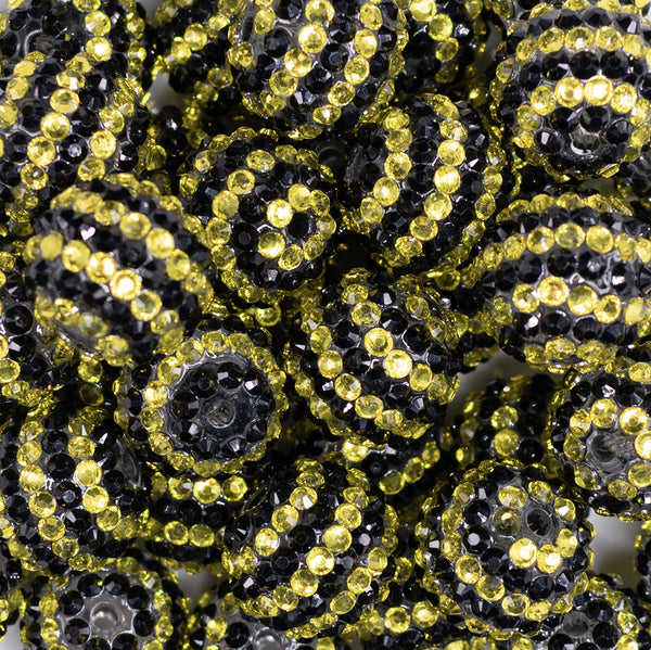 close up view of a pile of 20mm Black and Yellow Striped Rhinestone Bubblegum Beads
