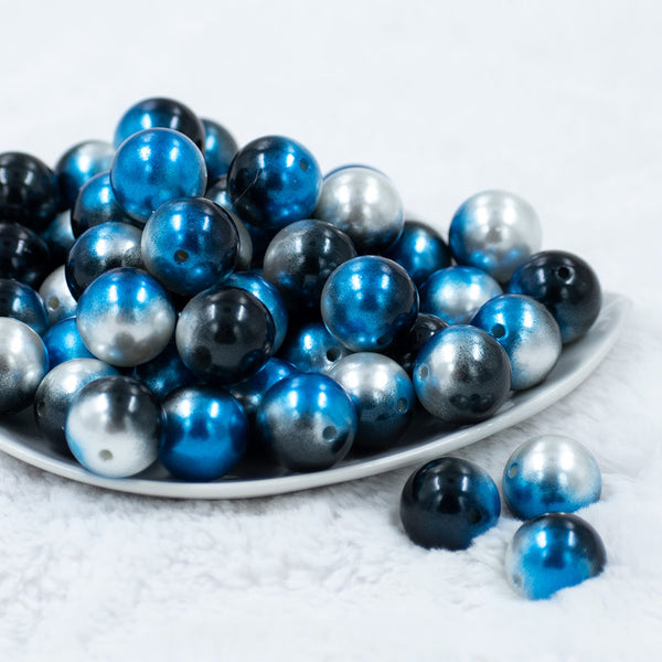 Front view of a pile of  20mm Blue & Black Ombre Shimmer Faux Pearl Bubblegum Beads