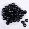 Top view of a pile of 20mm Black with Glitter Faux Pearl Bubblegum Beads
