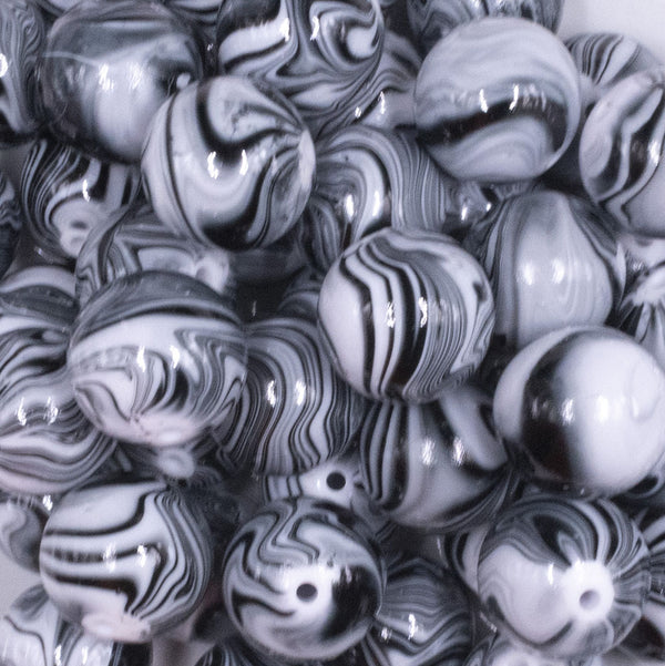 close up view of a pile of 20mm Black Marbled Bubblegum Beads