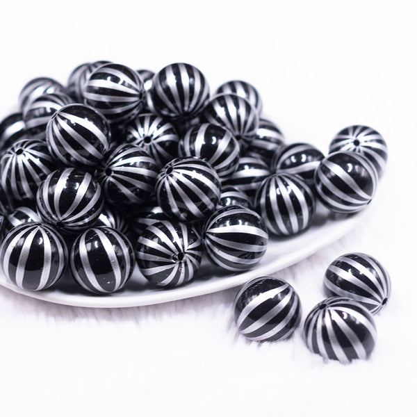 Front view of a pile of 20mm Black with Silver Pin Stripes Acrylic Bubblegum Beads